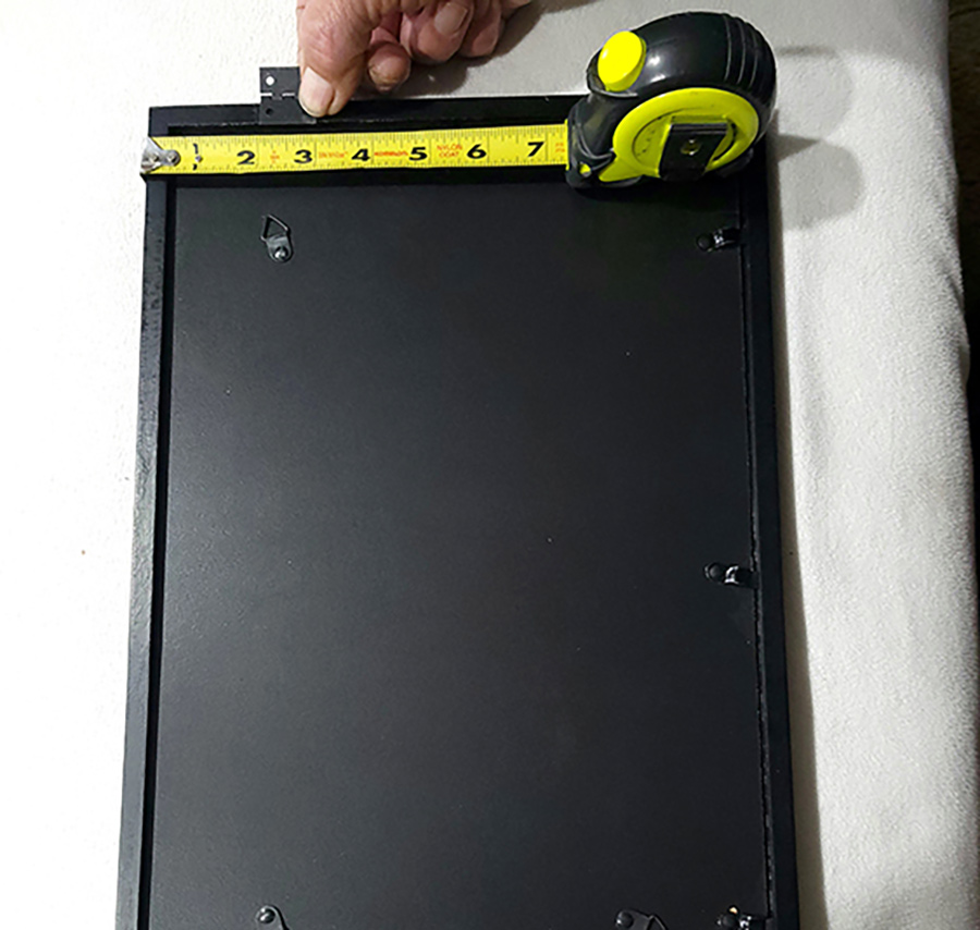 Measurements were taken for locating the small hinges on the picture frame. These hinges are available in just about any hardware store.