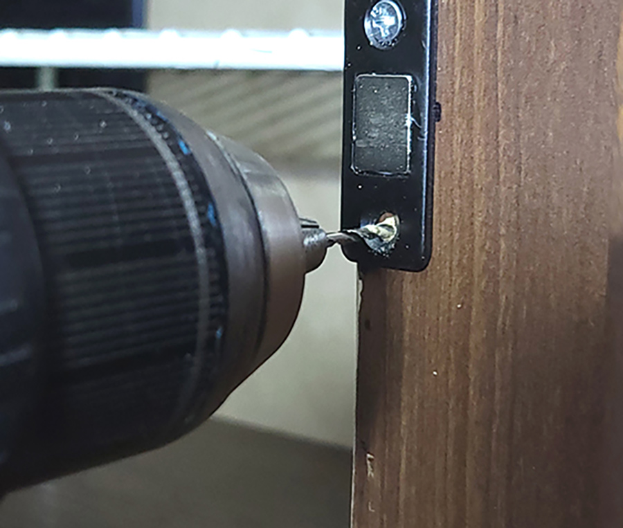 One magnetic catch was needed to keep the picture frame closed. These catches are available on Amazon (“Cabinet Door Magnets Jiayi 6 pack,” $10.99). They can be attached with the enclosed screws or two-face tape; screws were used here.