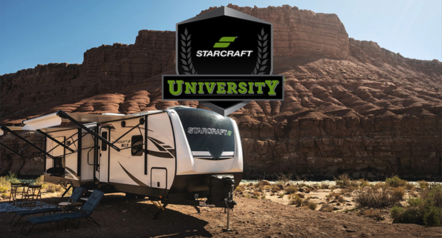 Starcraft University logo imposed over an image of an RV trailer parked near a large desert rock formation