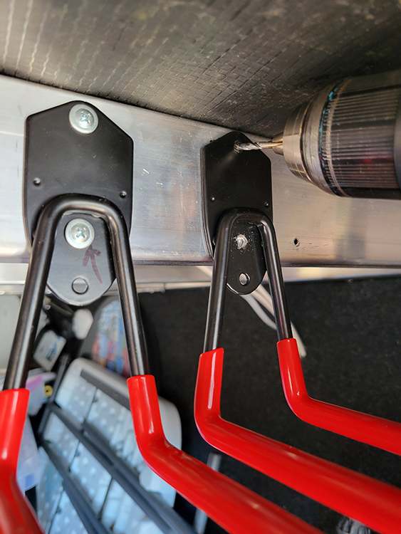 One screw was tightened enough to keep the hook base in place so it could be aligned on the rafter, then the second pilot hole was drilled for acceptance of the second screw. Although the fasteners came with the kit, I preferred to mount the hooks with 1-inch Lath screws, which are tougher and have a wider head.