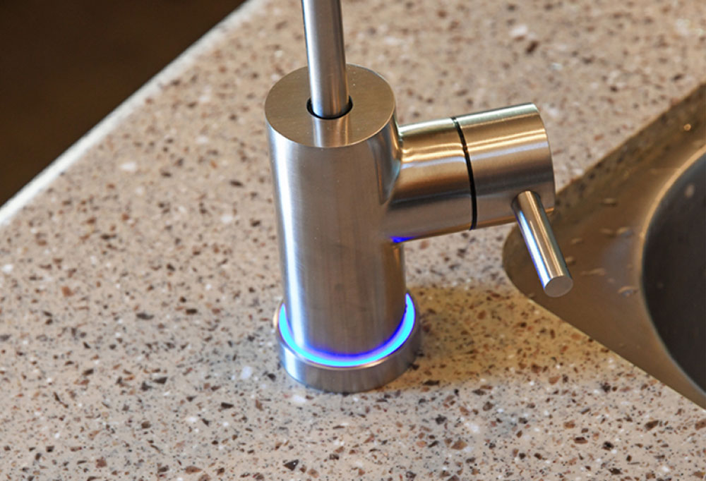 Installed Smart Faucet with base ring light lit blue