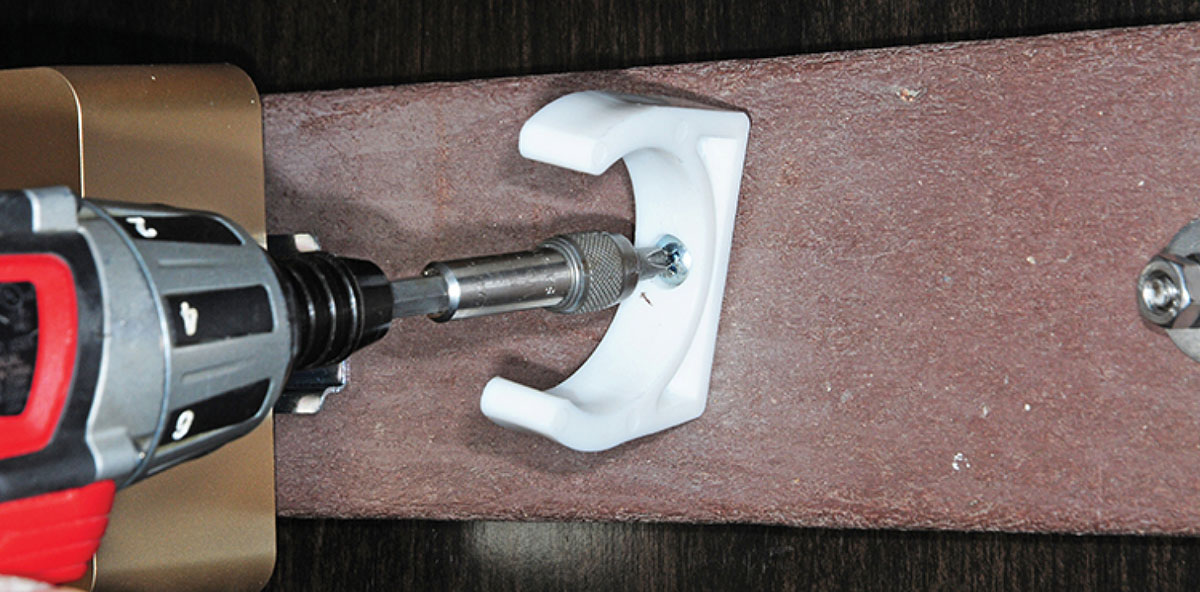 Pre-filter mounting clip screwed into board