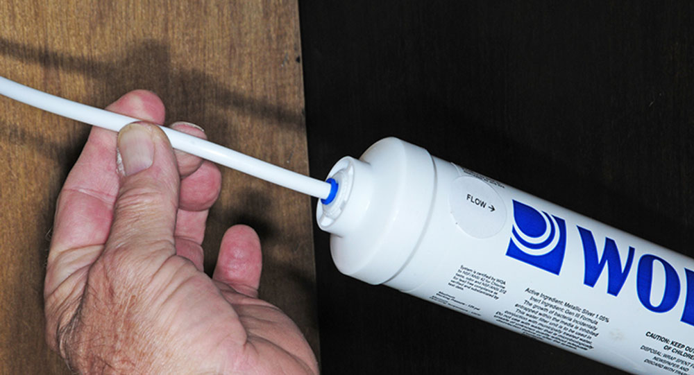 Pushing 1/4 water line into filter