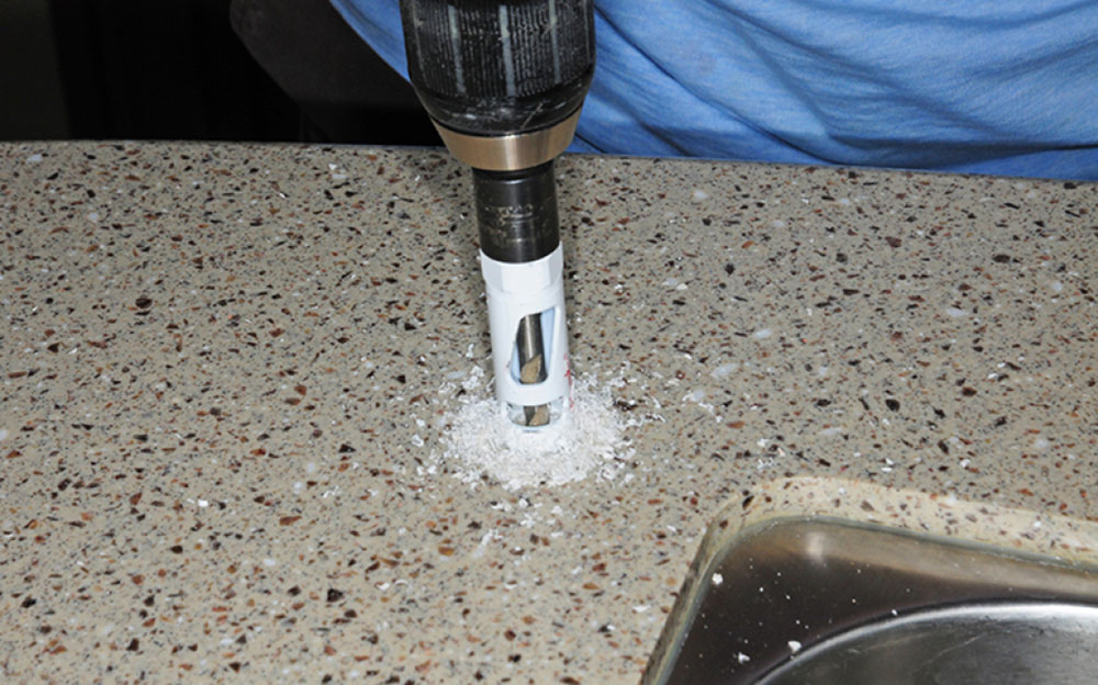 Drilling hole into countertop for faucet