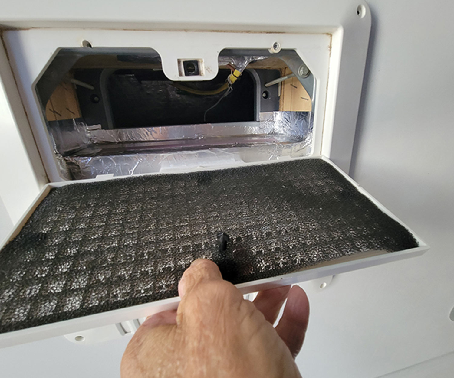 the hold-down panel is removed with the return-air filter attached