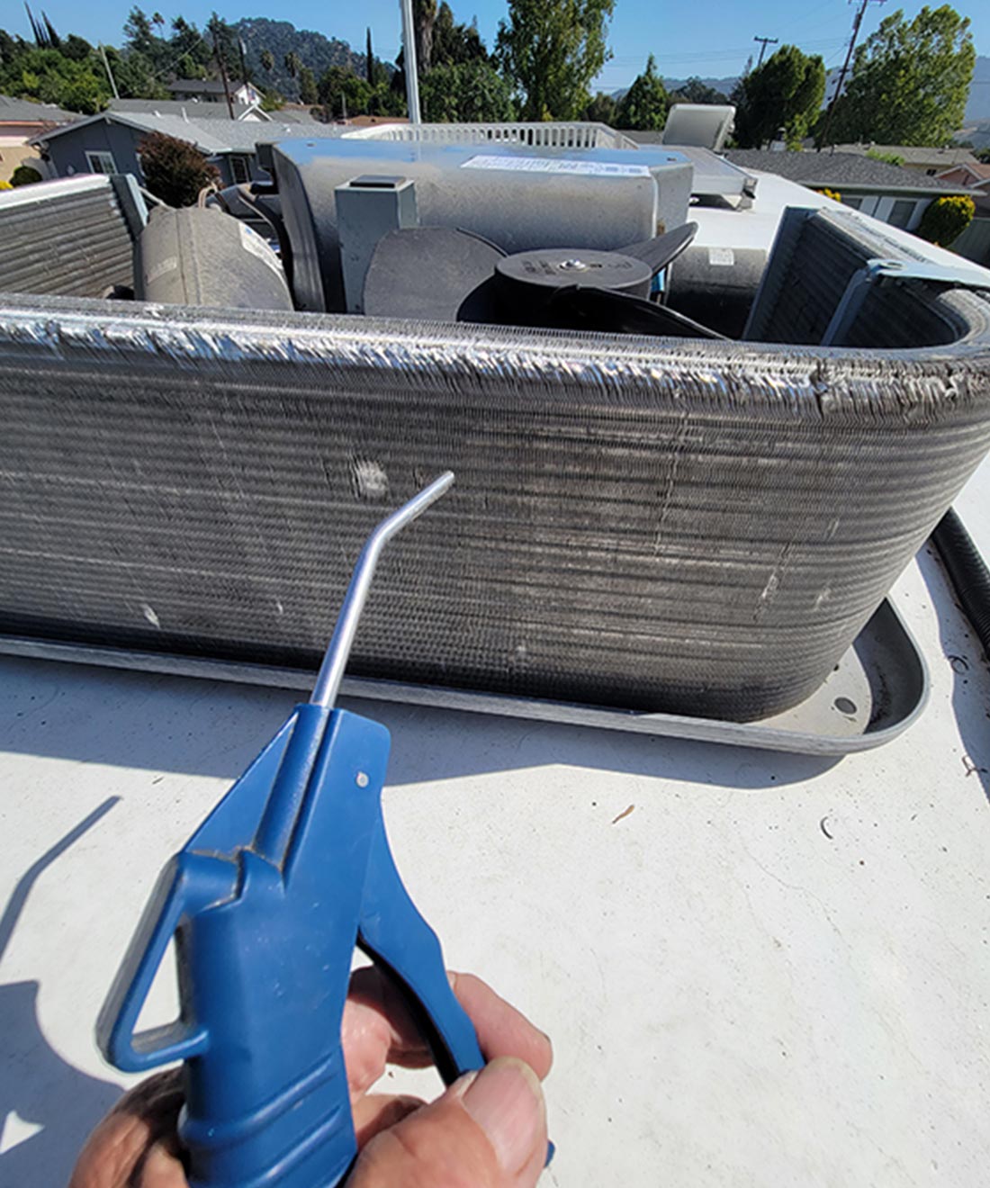 with the bulk of debris is removed, compressed air through an air gun is directed to the condenser coils (no closer than 8-10 inches) to blow away the remaining dust and dirt