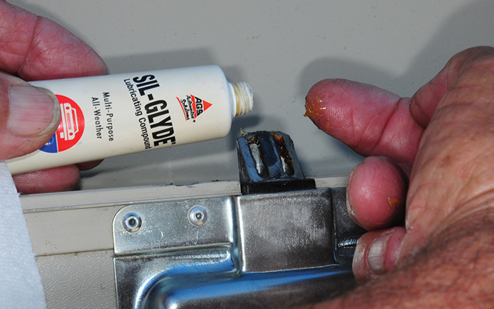 Applying Sil-Gyde to door latch