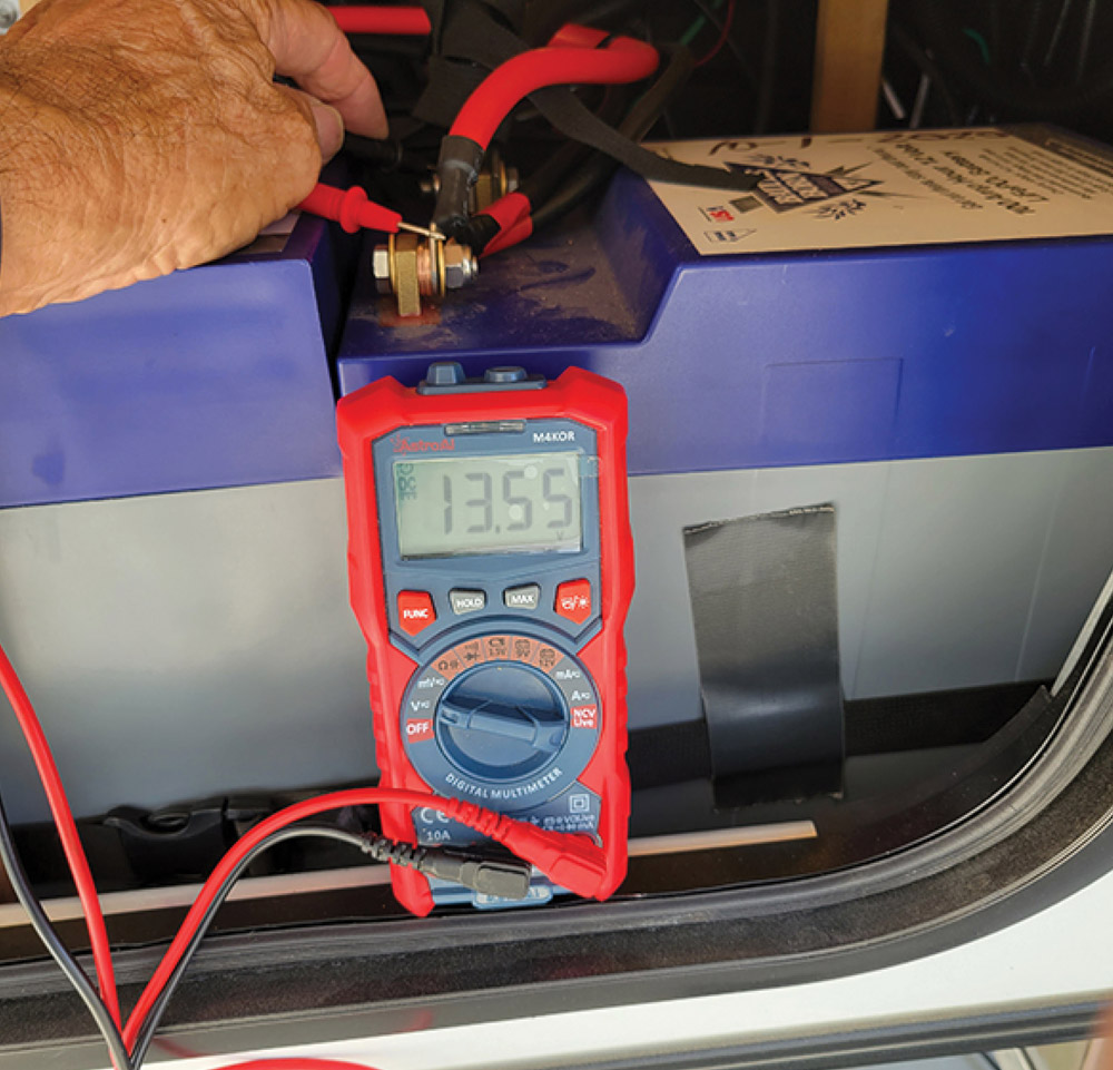 battery voltage being tested on a battery