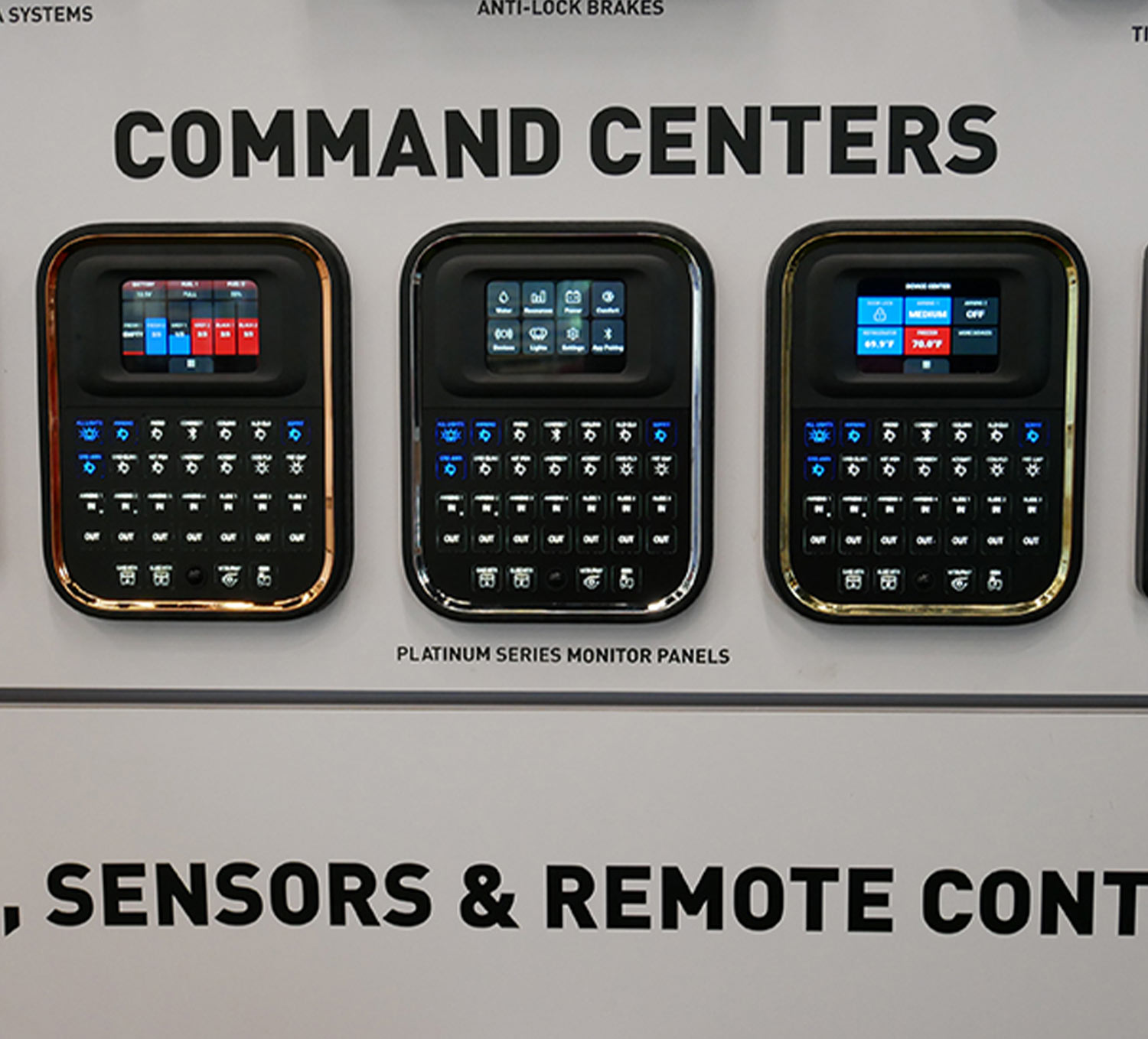 close up of three Lippert Platinum Series OneControl monitor panels on a large OneControl display