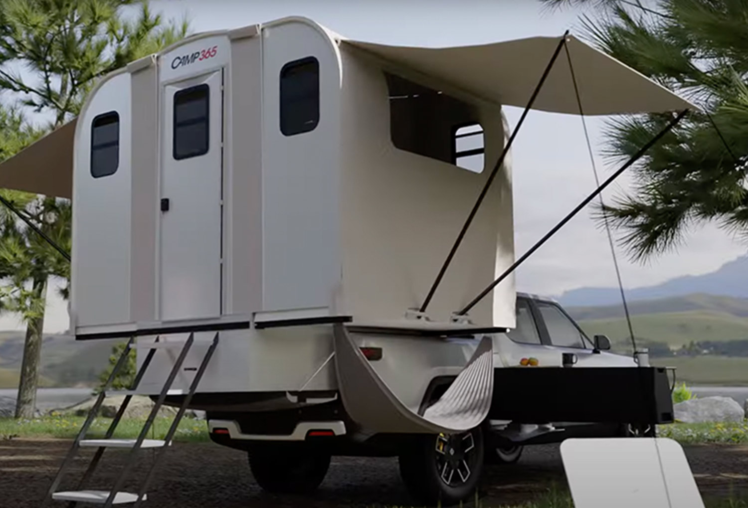 the CAMP365 T Model unfolded on the back of a Rivian R1 truck