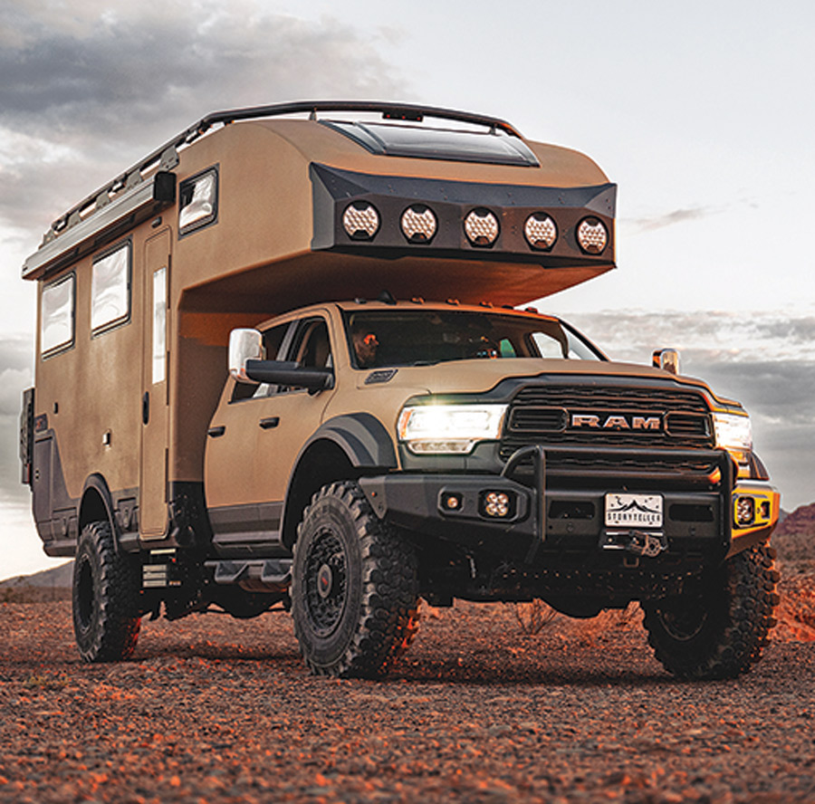 Storyteller Overland GVX Hilt tan exterior with Ram logo on the front of the vehicle