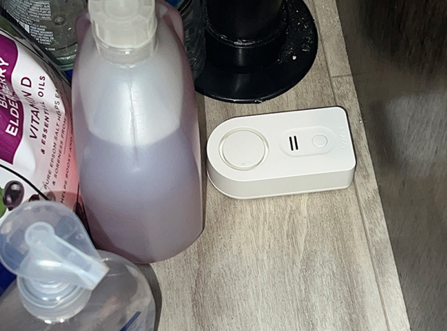 Govee (H5054) water alarm sensor located under the bathroom sink