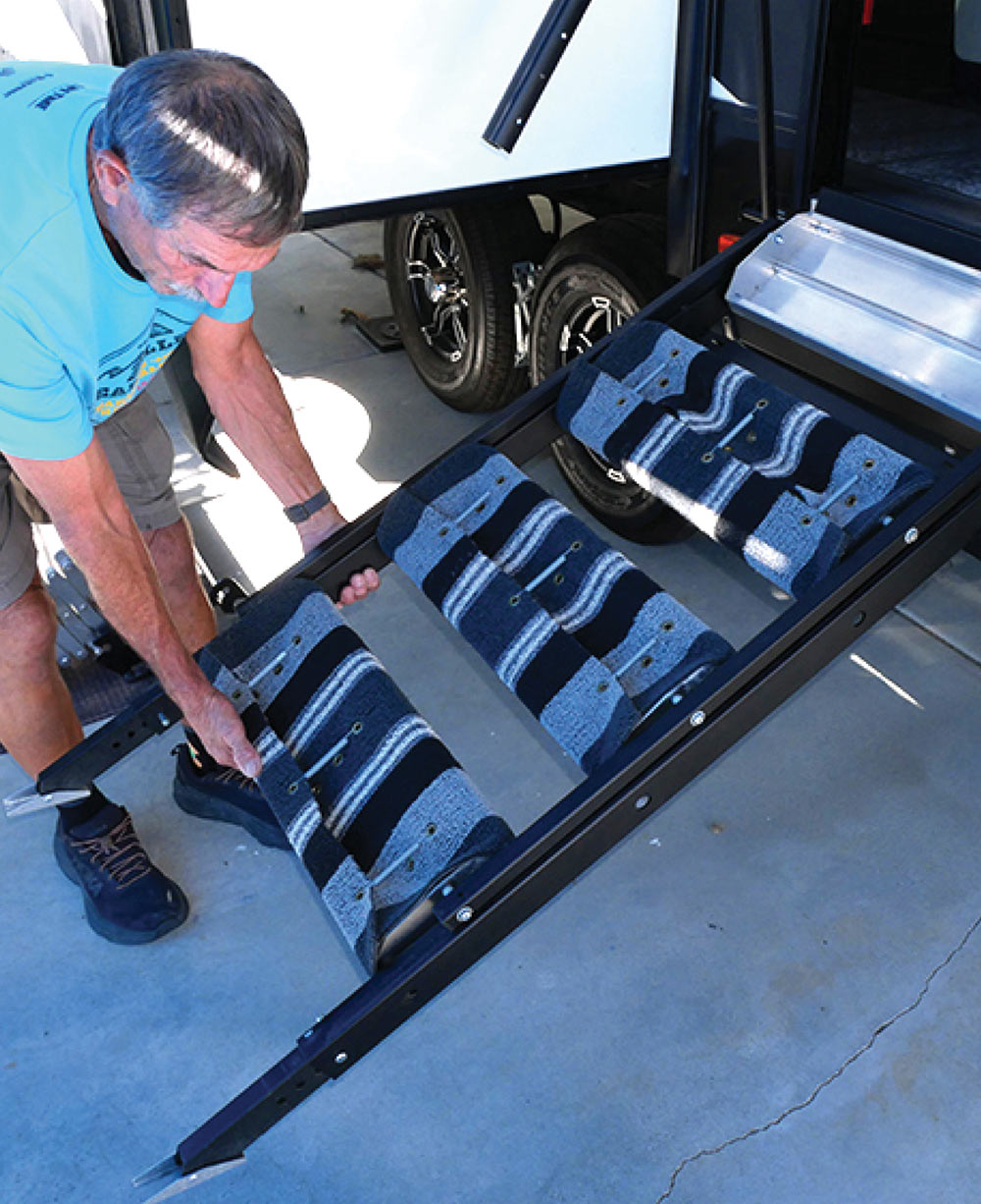 Drawbridge-type entryway steps being lowered