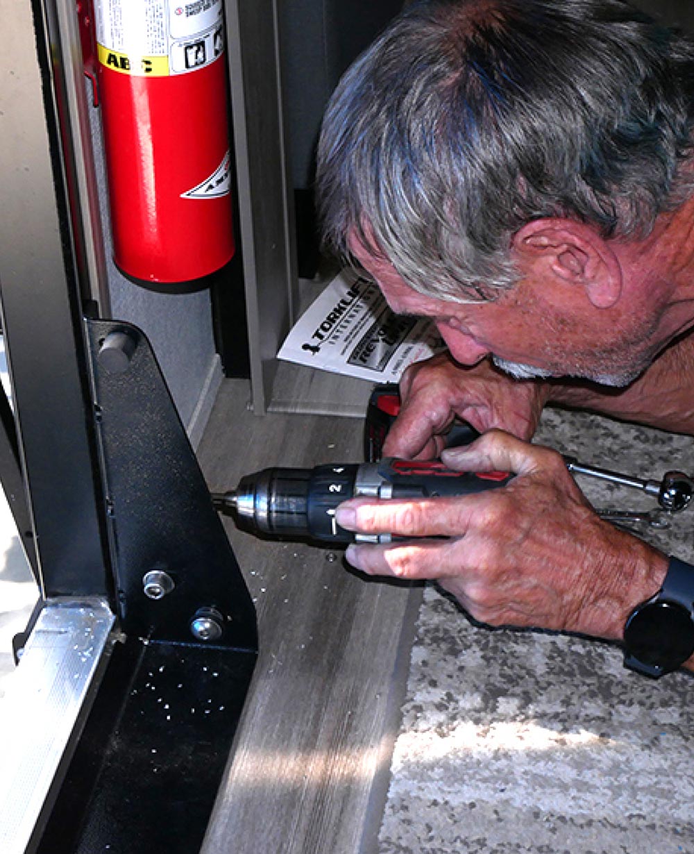 Drilling holes in door frame for new bracket