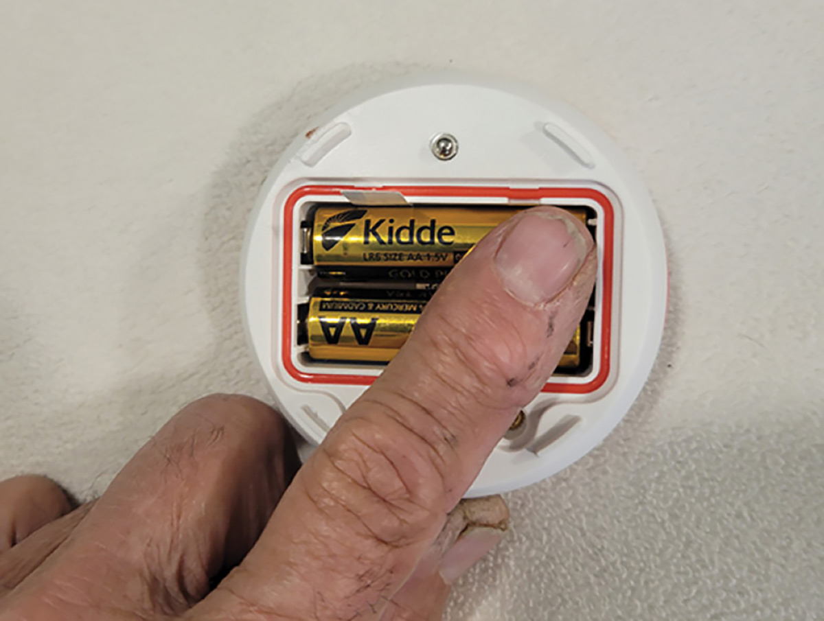 Kidde batteries being placed into unit