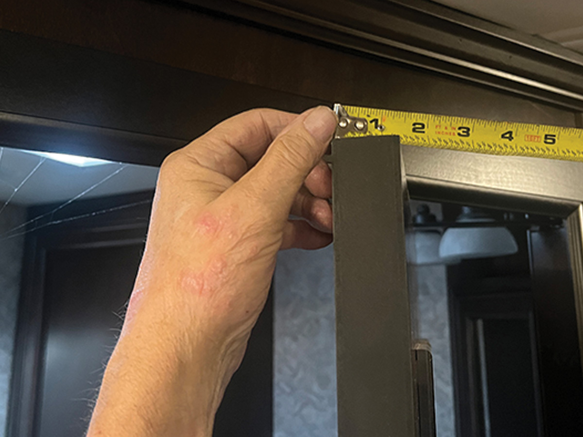 hand holding model of three hooks put together