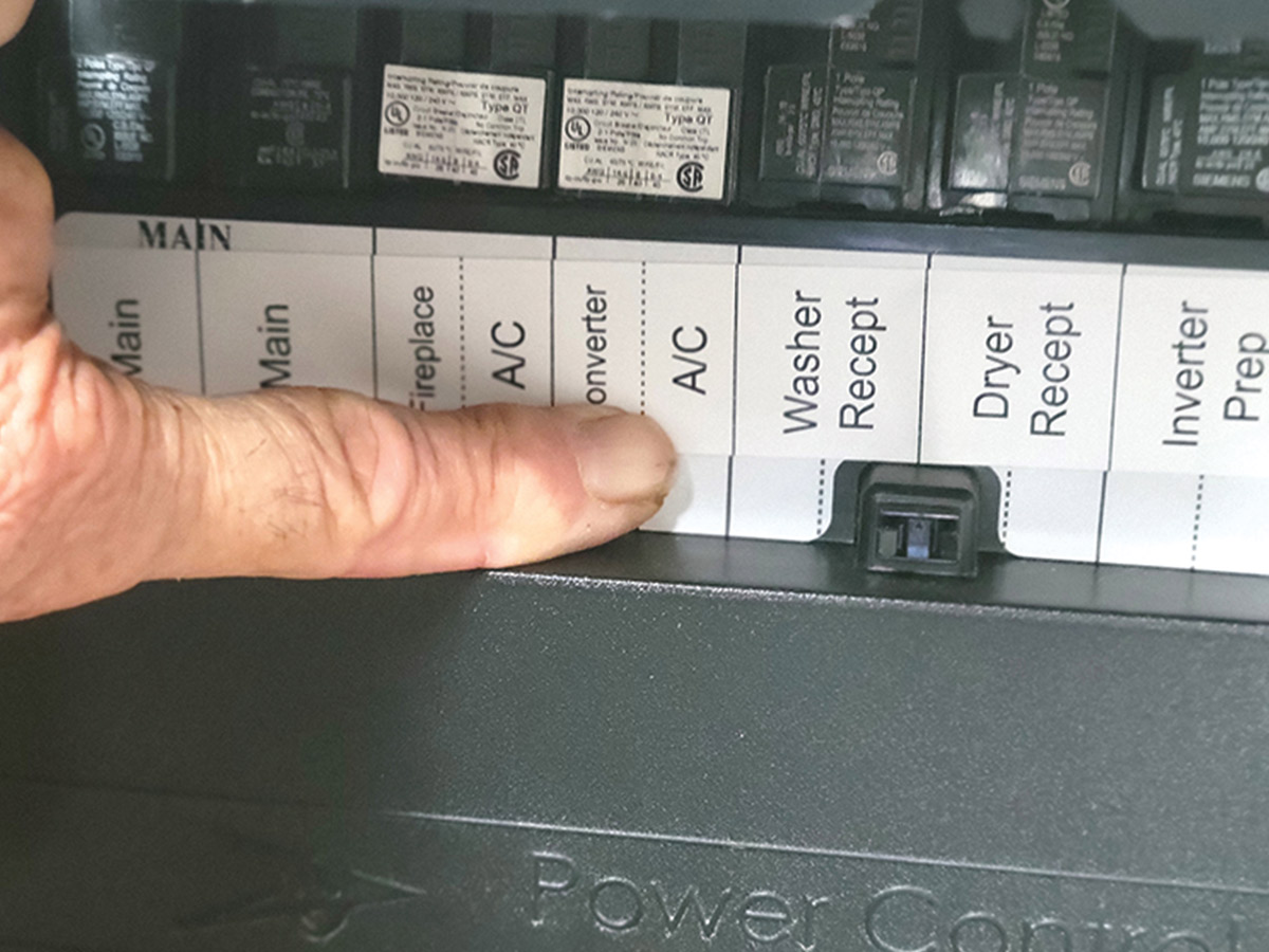 finger pointing breaker labeled AC