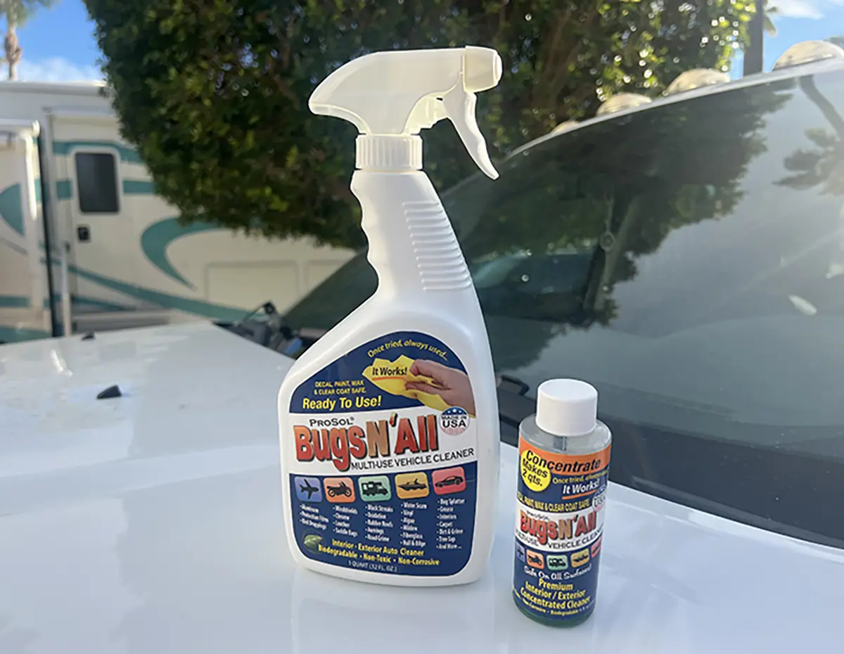 Landscape close-up photo view of the ProSol Bugs N All Multi-Use Vehicle Cleaners kit showcasing a bigger bottle and a smaller bottle on top of a white truck