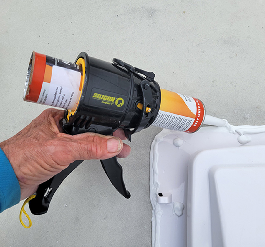 closeup of Siligun being used to lay down sealant