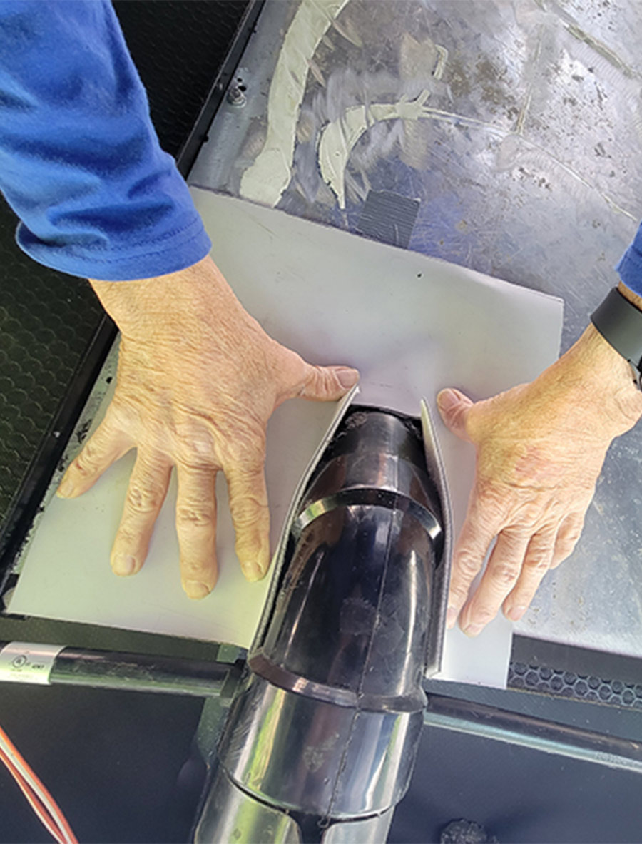 piece of rubber roof membrane being mounted onto the diamond plate