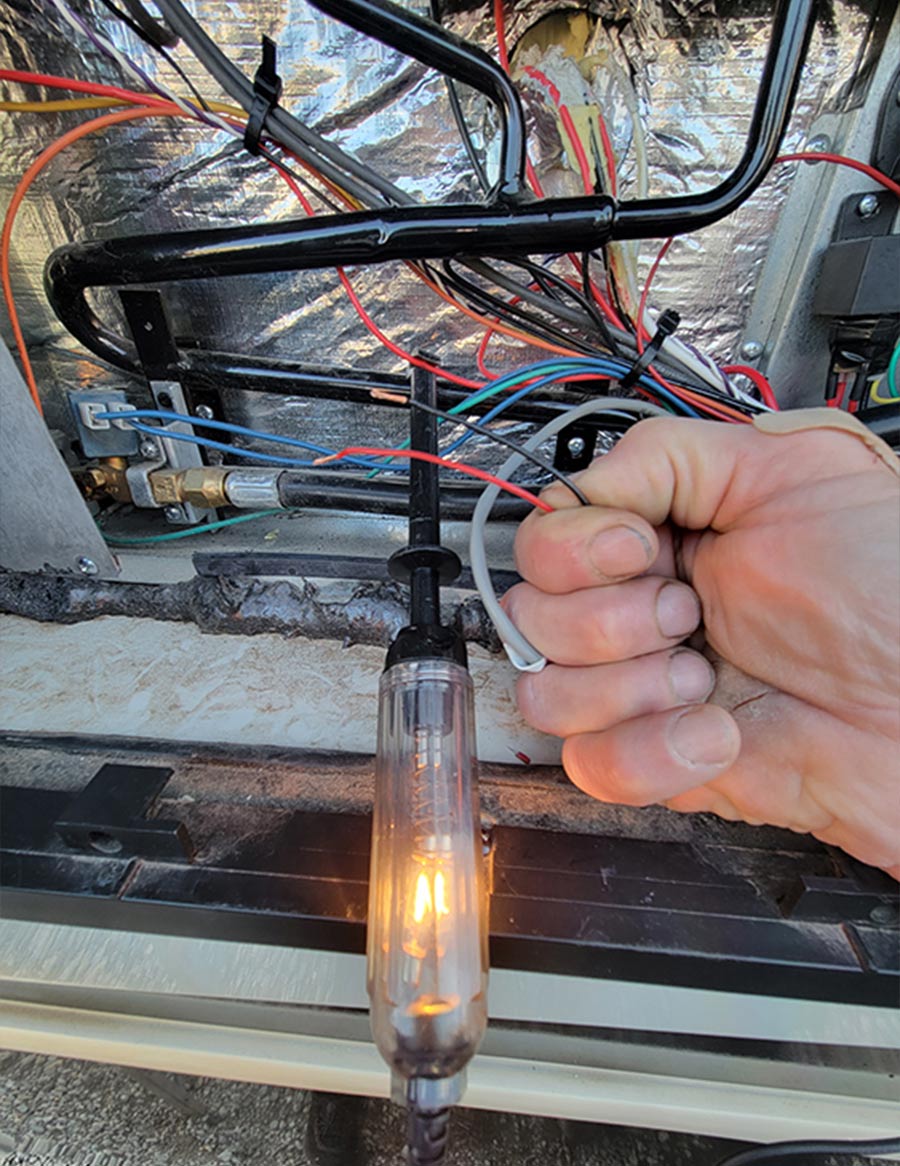 test light being used to source a constant 12-volt DC power wire for the interior fans