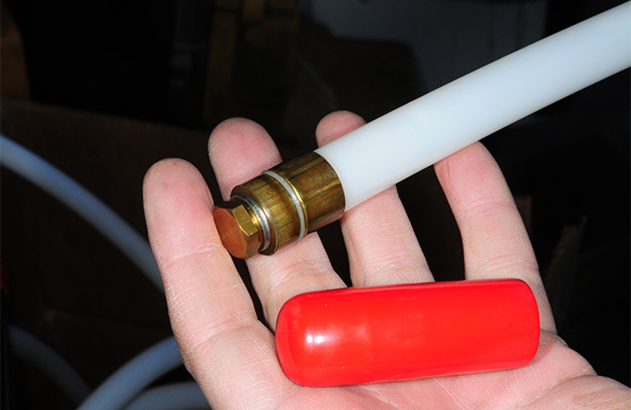 closeup of hand holding up a tube