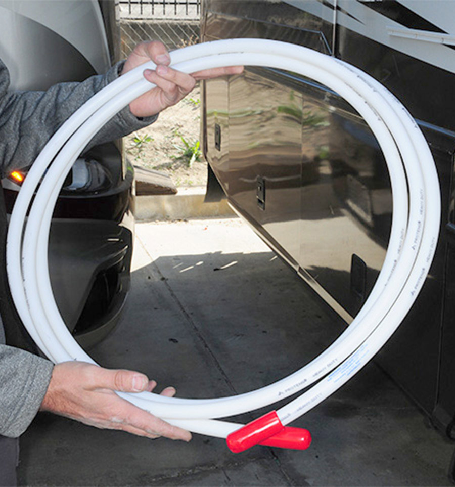 person holding up a coiled tube