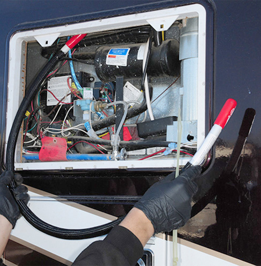 tube being routed through the back of the refrigerator