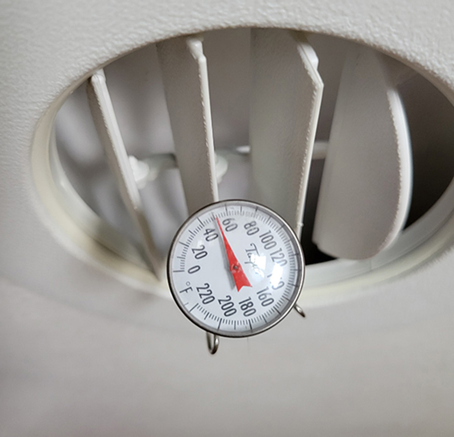 air conditioning thermometer inserted through a vent