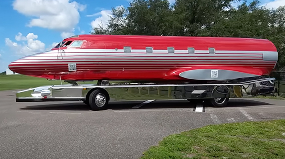 side view of Elvis Presely's red 1962 Lockheed L-1329 JetStar transformed into an RV trailer